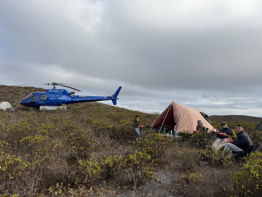 A private helicopter beside a fly camp in the Tanzanian bush