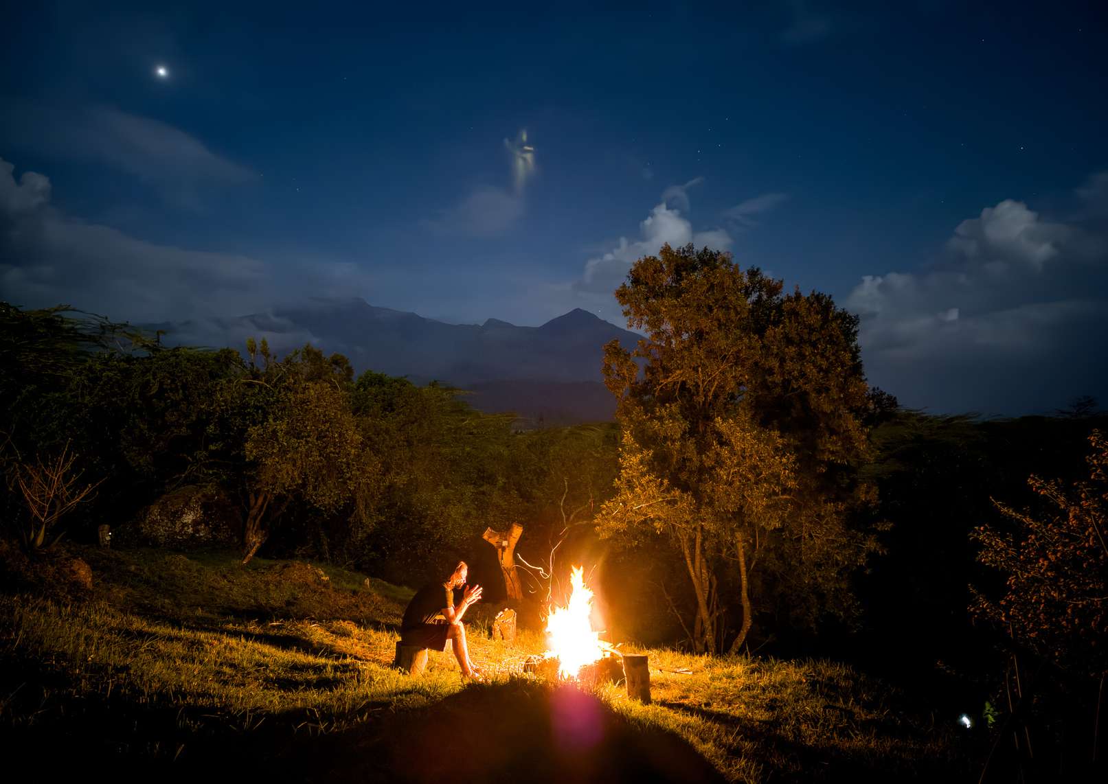 Campfire under the night sky
